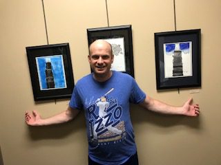 person standing near artwork